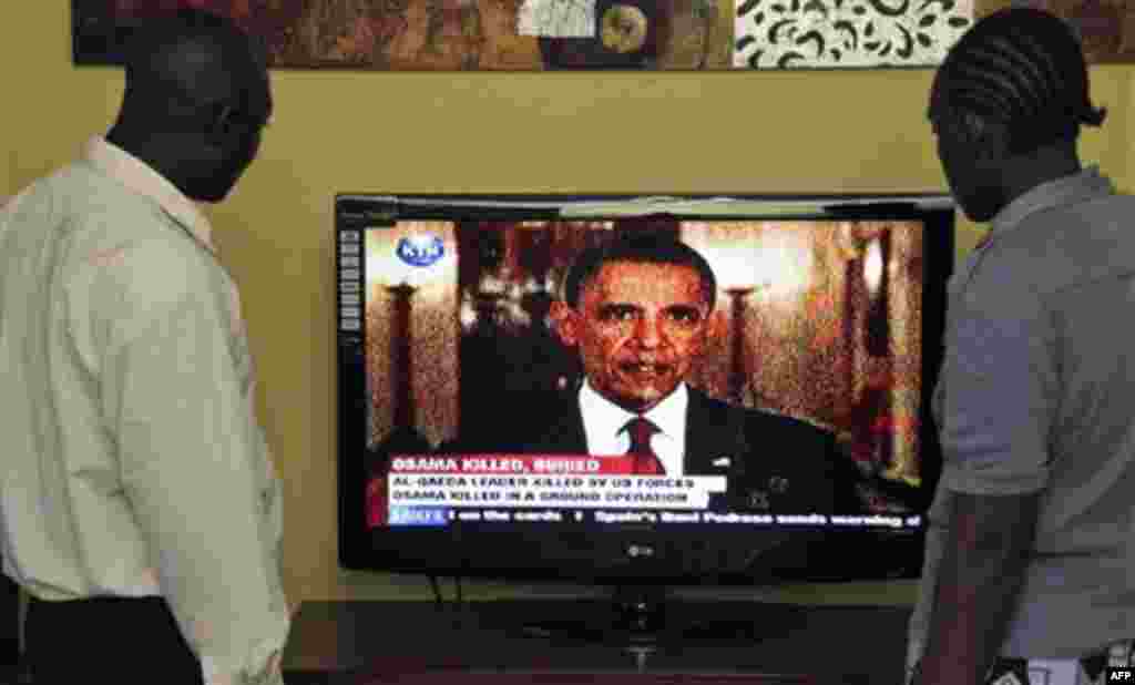 Kenyans watch U.S. President Barack Obama,on television in Nairobi, Kenya announcing the death of Osama bin Laden in Pakistan, Monday, May 2, 2011 (AP Photo/Sayyid Azim)