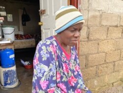 Edeline Gweshe has lived in her now-flooded home for 10 years. (Columbus Mavhunga/VOA)