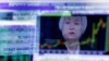 FILE - Federal Reserve Chair Janet Yellen is reflected in a specialist's screen on the floor of the New York Stock Exchange, June 15, 2016. 