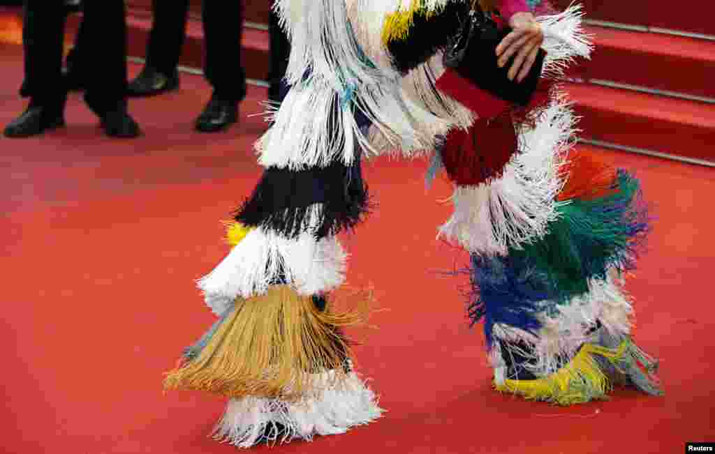 A guest arrives at the 72nd Cannes Film Festival Red Carpet for the screening of "Pain and Glory," in Cannes, France.