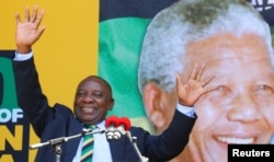 FILE - South African Deputy President Cyril Ramaphosa attends a rally to commemorate Nelson Mandela's centenary year in Cape Town, South Africa, Feb. 11, 2018.