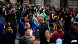 FILE—People queue outside of the South African High Commission in central London on May 18, 2024, to vote in South Africa's forthcoming general election.