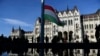 FILE - The official flag-raising ceremony for the 66th anniversary of Hungarian anti-communist uprising of 1956 in front of the Parliament in Budapest, Hungary on Oct. 23, 2022. 