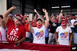 Supporters cheer as President Donald Trump speaks during a campaign rally at Wittman Airport in Oshkosh, Wis., Aug. 17, 2020.