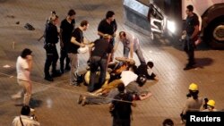 Protesters are detained by plainclothes police during an anti-government protest at Taksim Square in Istanbul, June 29, 2013. 