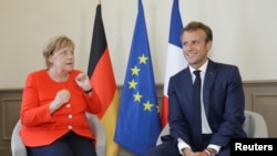 Bà Merkel và Tổng thống Emmanuel Macron của Pháp 