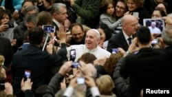 Pope Francis arrives to lead the weekly audience in Paul VI's hall at the Vatican, Jan. 20, 2016.