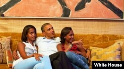 President Barack Obama and his daughters, Malia (l) and Sasha, watch on TV as First Lady Michelle Obama delivers her speech at the Democratic National Convention, Sept. 4, 2012. (Official White House Photo by Pete Souza)