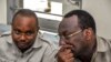 FILE - Chadema party chairman Freeman Mbowe (R) and party's General Secretary John Mnyika sit in the dock at Kisutu resident magistrates court in Dar es Salaam on March 10, 2020. 