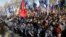 Ultra-right activists holds march during a rally against tycoons in national politics and economy in central Kiev, Ukraine, April 3, 2018.