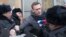 FILE - Russian opposition leader Alexei Navalny (C) is detained by police officers in Moscow, Jan. 28, 2018. 