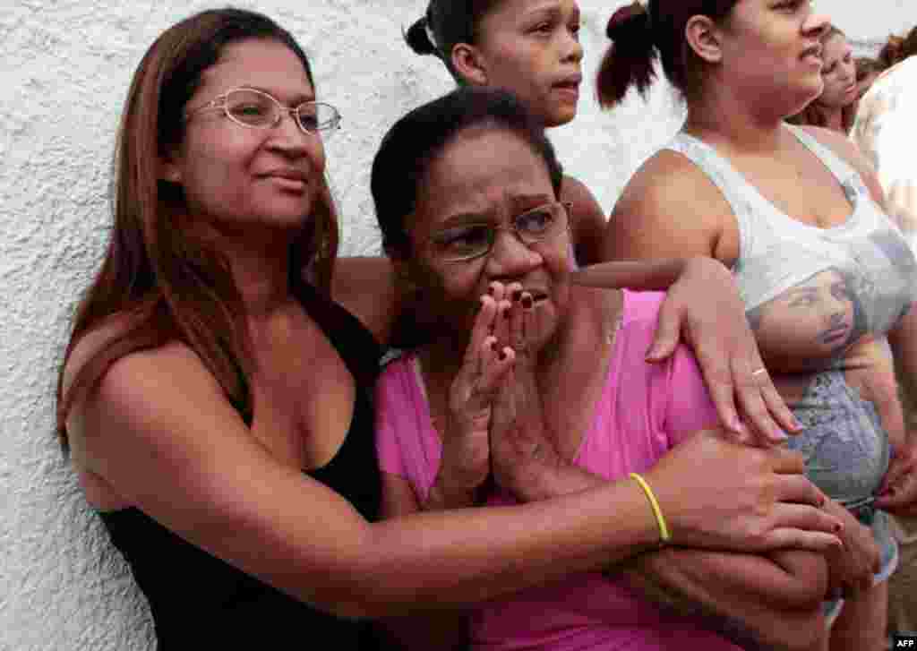 April 7: Parents and relatives of school children wait for news outside the Tasso da Silveira school where a gunman opened fire on children in the Realengo neighborhood of Rio de Janeiro. The gunman killed 12 people in a shooting spree at the school befor