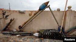 Weapons and ammunition belonging to Islamic State militants are seen in the town of Bashiqa, east of Mosul, Iraq, Dec. 14, 2016. 