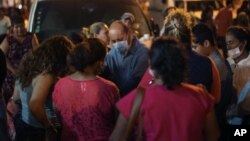 Relatives of missing workers of a nearby petrochemical plant of the state oil company Petroleos Mexicanos ( Pemex ) pray as they wait for news news about their loved ones outside the local hospital in Coatzacoalcos, Mexico on April 20, 2016.