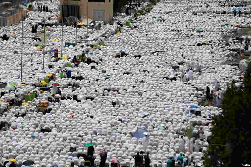 Muslim pilgrims pray outside Namira Mosque on the plains of Arafat during the annual haj pilgrimage, outside the holy city of Mecca, Saudi Arabia.