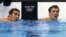 Michael Phelps (L) and Ryan Lochte of the U.S. check their times after their men's 200m individual medley semi-final during the London 2012 Olympic Games at the Aquatics Centre August 1, 2012. 