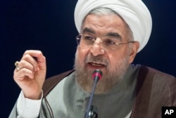 Iran's President Hassan Rouhani speaks during a news conference in New York, Sept. 26, 2014.