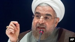 FILE - Iran's President Hassan Rouhani speaks during a news conference in New York, Sept. 26, 2014. 