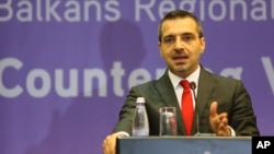 FILE - Saimir Tahiri, who then was Albania's interior minister, speaks at a news conference in Tirana, May 19, 2015.