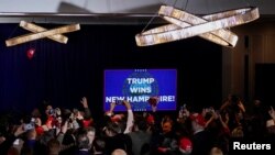 FILE - Supporters react after major news organisations project that Republican presidential candidate and former U.S. President Donald Trump wins, during a New Hampshire presidential primary election night watch party in Nashua, New Hampshire, U.S. January 23, 2024.