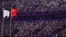The Olympic Council of Asia flag, left, and China's national flag fly during the opening ceremony of the Asian Games at the Hangzhou Olympic Sports Centre Stadium in Hangzhou in China's eastern Zhejiang province on Sept. 23, 2023.