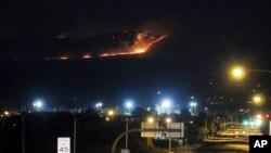 In this June 8, 2017 photo, the Dragoon fire is visible from just off Interstate 10, seen from Benson, Ariz.