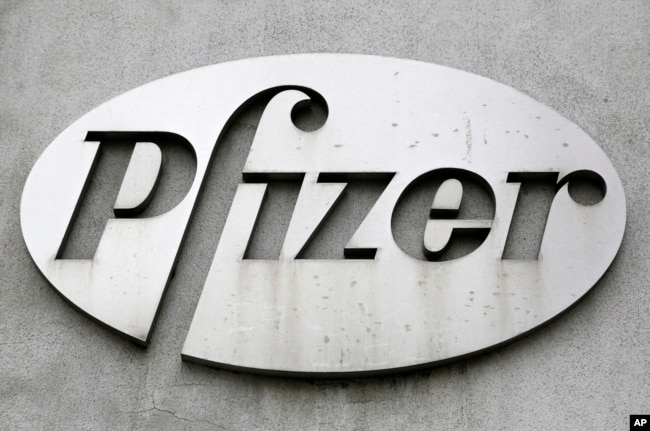 FILE - The Pfizer logo is displayed on the exterior of a former Pfizer factory, on May 4, 2014, in the Brooklyn borough of New York. Pfizer is one of the companies working on a new weight-loss pill. (AP Photo/Mark Lennihan, File)