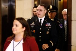 FILE - Army Lieutenant Colonel Alexander Vindman, a military officer at the National Security Council, center, arrives on Capitol Hill in Washington, Oct. 29, 2019.