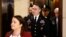 Army Lieutenant Colonel Alexander Vindman, a military officer at the National Security Council, center, arrives on Capitol Hill in Washington, Oct. 29, 2019, to be interviewed as part of the impeachment inquiry into President Donald Trump.