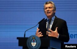 Argentina's President Mauricio Macri gestures as he speaks during a ceremony to announce economic measures at the Kirchner Cultural Center in Buenos Aires, Argentina, Oct. 30, 2017.