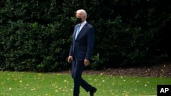 FILE - President Joe Biden walks to board Marine One on White House grounds, in Washington, Oct. 7, 2021. Biden heads to Europe, for the second foreign trip of his presidency, Oct. 29, 2021. 