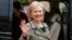Former U.S. Secretary of State Hillary Clinton waves as she leaves after a meeting at the Elysee Palace in Paris, July 8, 2014. REUTERS/Benoit Tessier (FRANCE - Tags: POLITICS) - RTR3XMF9