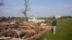 A Tuesday morning photo shows Larry Nelson, 73, as he surveys what’s left of his home after Monday's tornadoes struck Pilger, Nebraska, June 17, 2014.  