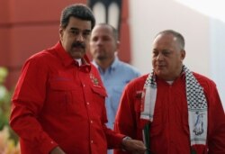 FILE - Venezuela's President Nicolas Maduro (L) and President of Venezuela's National Constituent Assembly Diosdado Cabello are seen during a meeting of the Sao Paulo Forum, in Caracas, Venezuela, July 28, 2019.