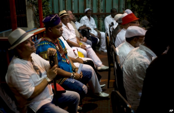 Santeria priests attend the reading of the annual Letter of the Year, written by Afro-Cuban Santeria priests, listing predictions for the new year in Havana, Cuba, Jan. 3, 2017.