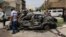 Residents gather at the site of a car bomb attack in Baghdad, May 30, 2013. 