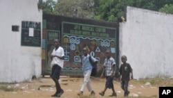 Children walk past JFK Medical centre in Monrovia, Liberia. Ebola centers. The trauma of the world’s deadliest Ebola outbreak, which killed more than 11,300, has left many survivors fighting a mental health battle to focus on the present, after witnessing drawn-out deaths and whole communities torn apart, March. 31, 2017.