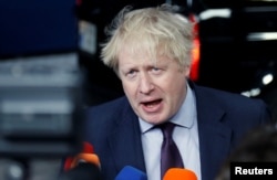 Britain's Foreign Secretary Boris Johnson talks to the media as he arrives at an European Union foreign ministers meeting in Brussels, Belgium, March 19, 2018.