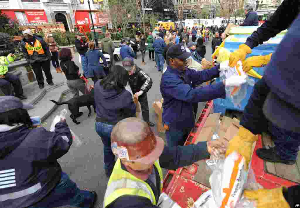 Dry ice is unloaded from a flatbed truck in Union Square for distribution to residents of the still powerless Chelsea section of Manhattan, Nov.1, 2012. 