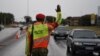 FILE - A Military Police officer gestures while checking the travel permits of motorists at a check point during the first day of the state of emergency in Gaborone, Botswana, Apr. 3, 2020. 