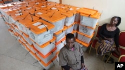 Polling agents guard ballot boxes as counting of ballot papers continues a day after presidential elections in Lusaka, Zambia, Jan, 21, 2015. 