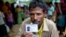 Mohammad Saleem, a Rohingiya man who crossed over to Bangladesh from Myanmar on Sept. 26, 2017, displays an identity card he was issued by the Bangladesh authorities at Kutupalong, Bangladesh, Oct. 1, 2017. 