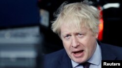 Former British Foreign Secretary Boris Johnson, seen in this March 2018 file photo, was told by the chairman of Britain’s governing Conservative Party to say sorry Tuesday for a newspaper column in which he wrote that burqa-wearing women looked like “letter boxes” and bank robbers, Aug. 7, 2018. 