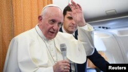 Pope Francis speaks to reporters during the flight from Skopje to Rome, at the end of his apostolic journey to Bulgaria and North Macedonia, May 7, 2019.