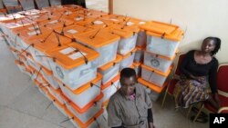 Polling agents guard ballot boxes as counting of ballot papers continues a day after presidential elections in Lusaka, Zambia, Jan, 21, 2015. 