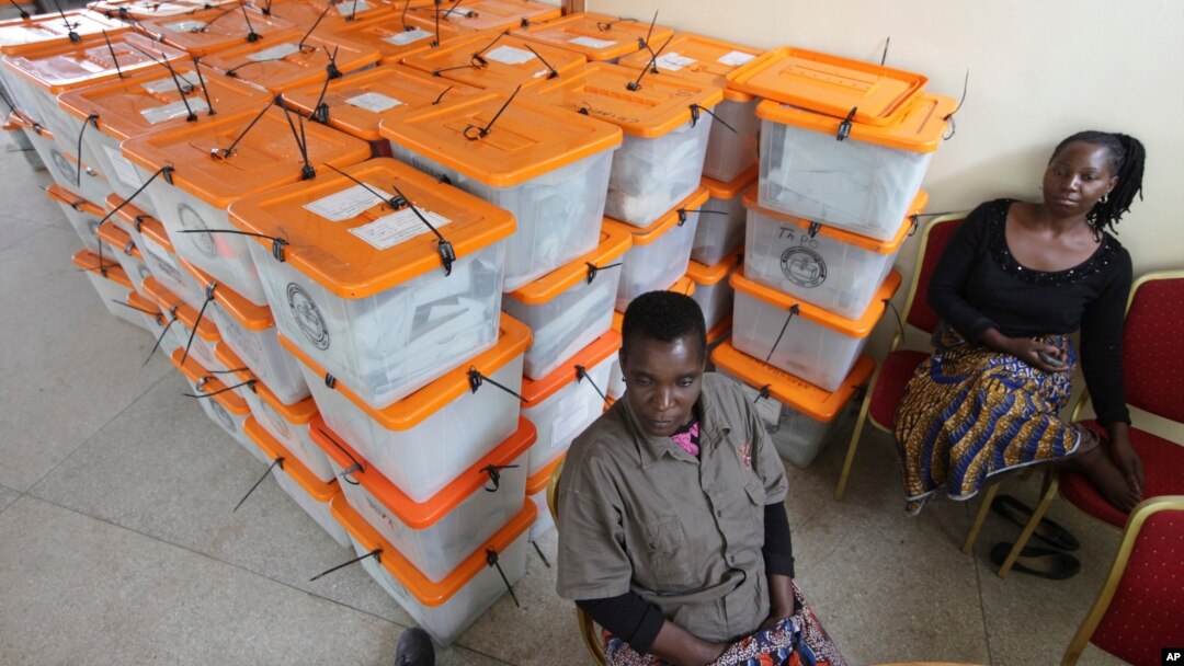 Polling agents guard ballot boxes as tallying continues a day after presidential elections, Lusaka, Zambia, Jan. 21, 2015.