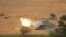 FILE - An Israeli mobile artillery unit fires a shell from southern Israel towards the Gaza Strip, in a position near the Israel-Gaza border, Wednesday, Dec. 27, 2023.