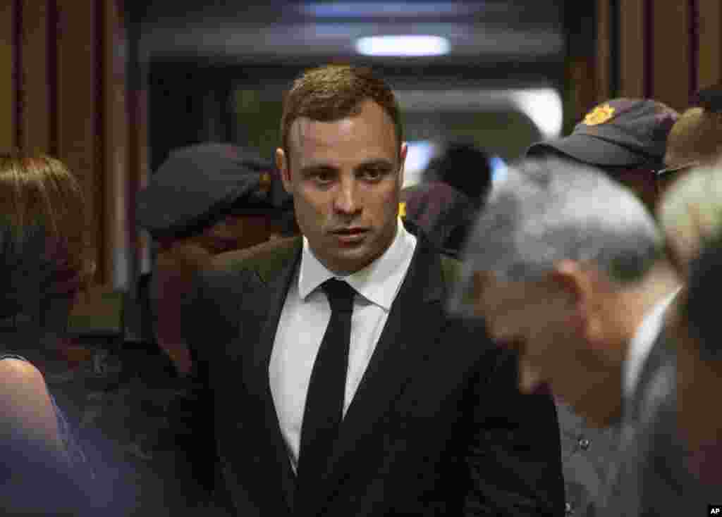 Oscar Pistorius arrives in court Monday to face sentencing for the shooting death of his girlfriend Reeva Steenkamp, Oct. 13, 2014.