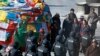  FILE - Chinese patrol on a street outside Jokhang Monastery in Lhasa, Tibet