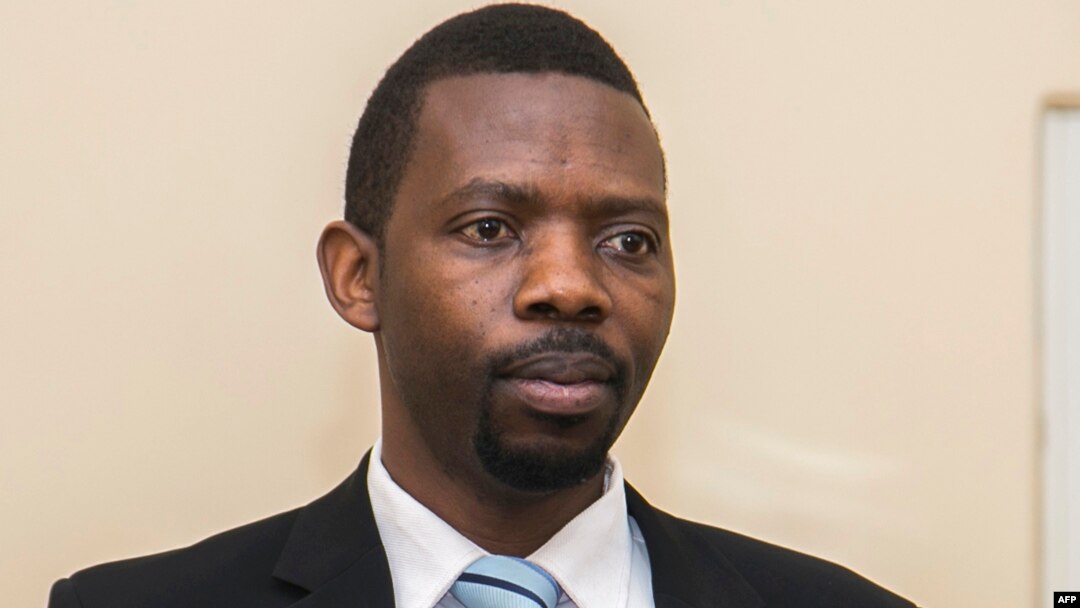FILE - Philippe Mpayimana speaks to the media during his first press conference in Kigali, Rwanda, Feb. 4, 2017.